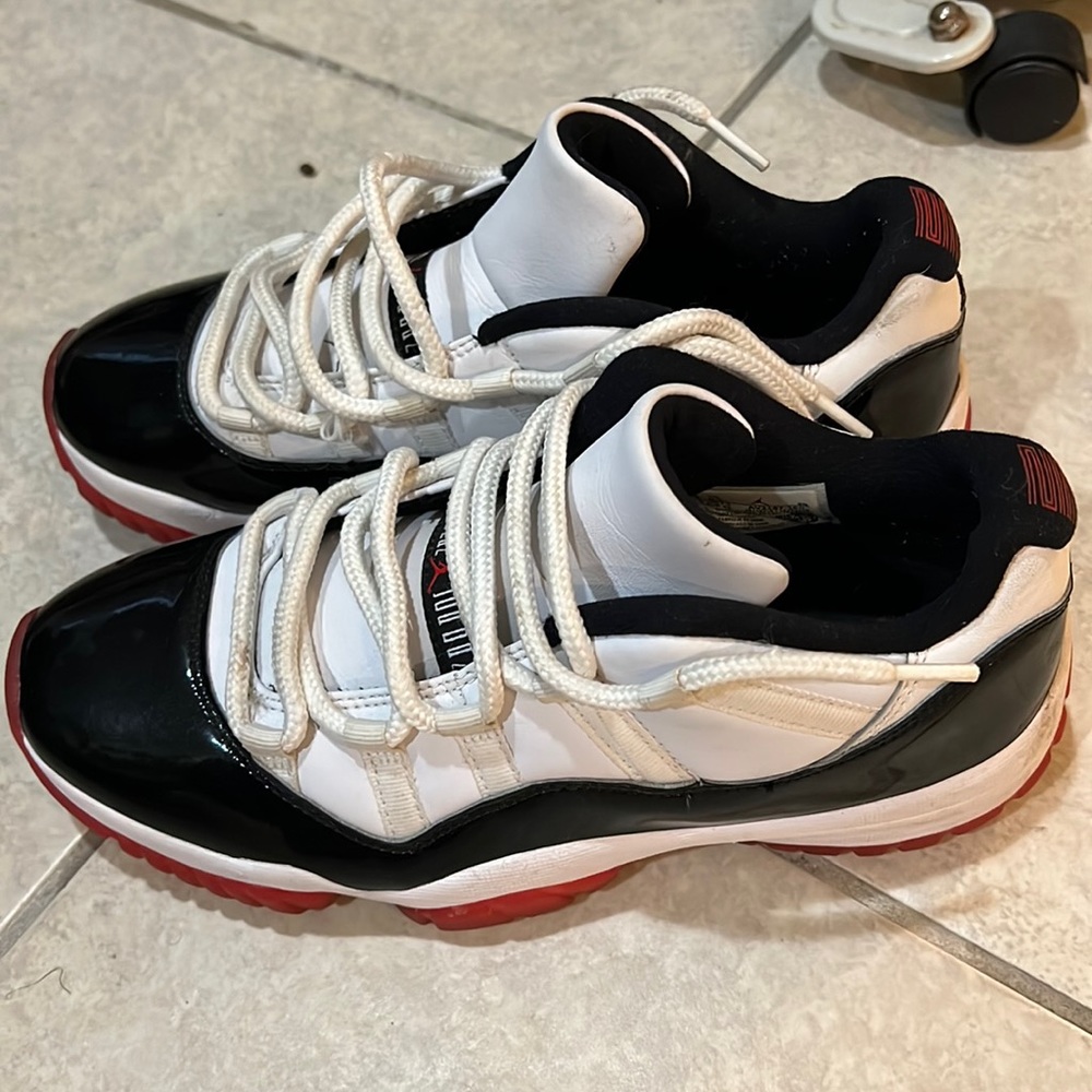 Retro Jordan 11 lows red white and black